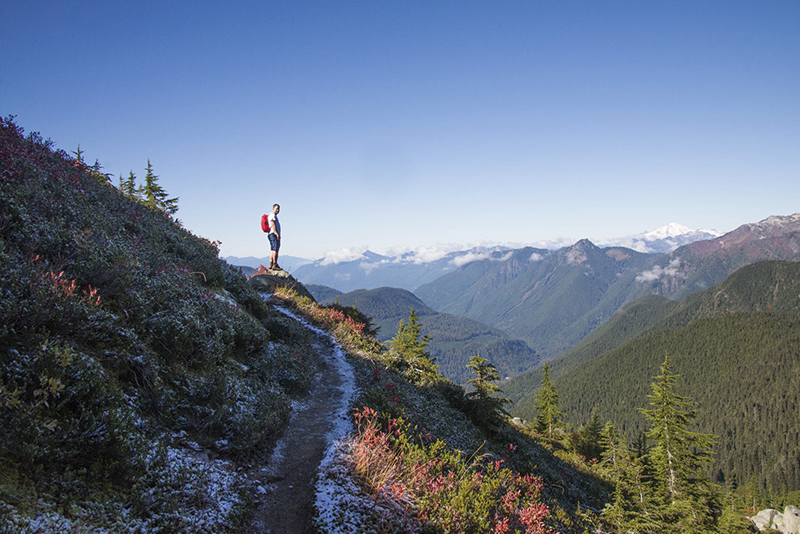man standing on the mountain
